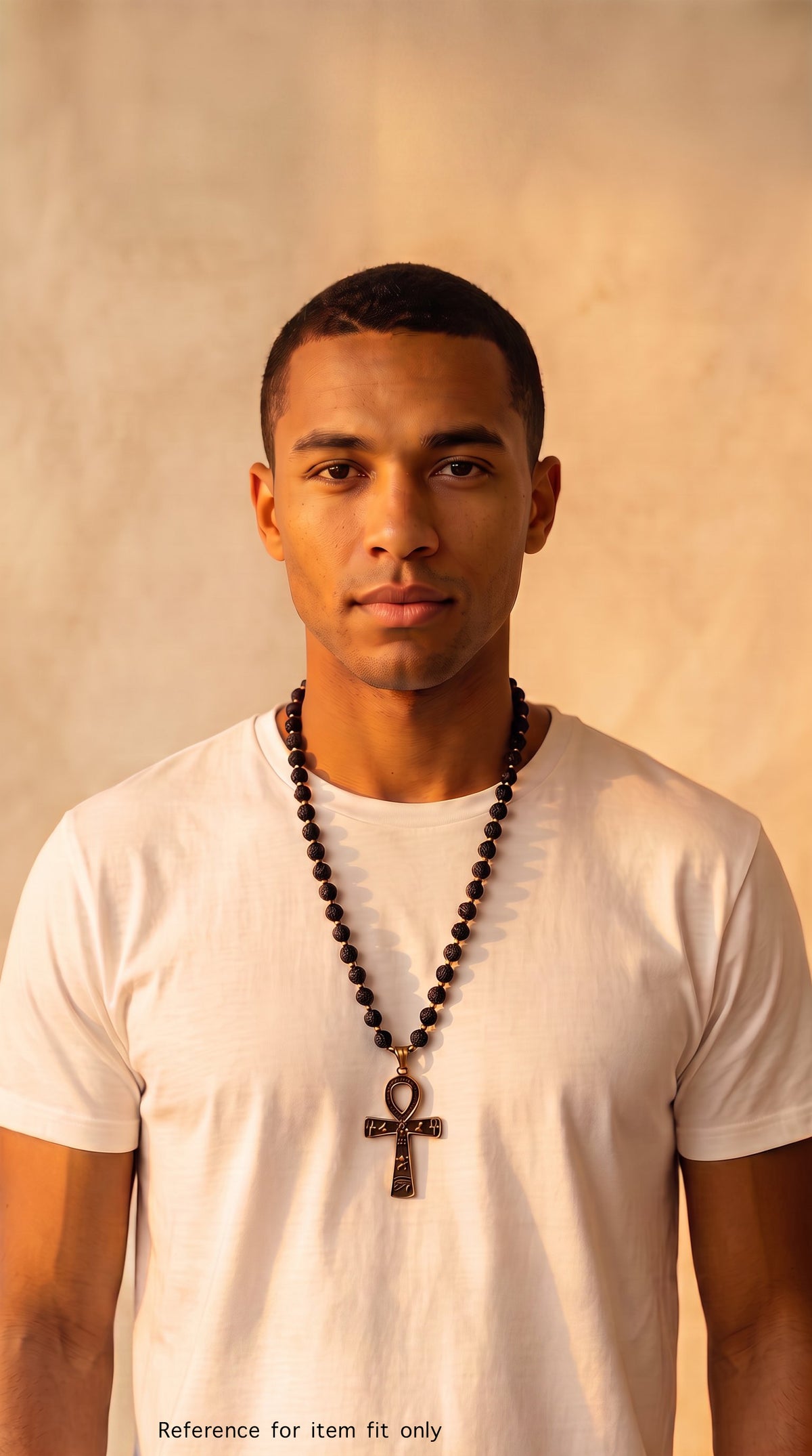 A man wearing a white t-shirt and a 14k gold-filled with black obsidian and lava bead necklace handmade by alaraJade Jewellery.
